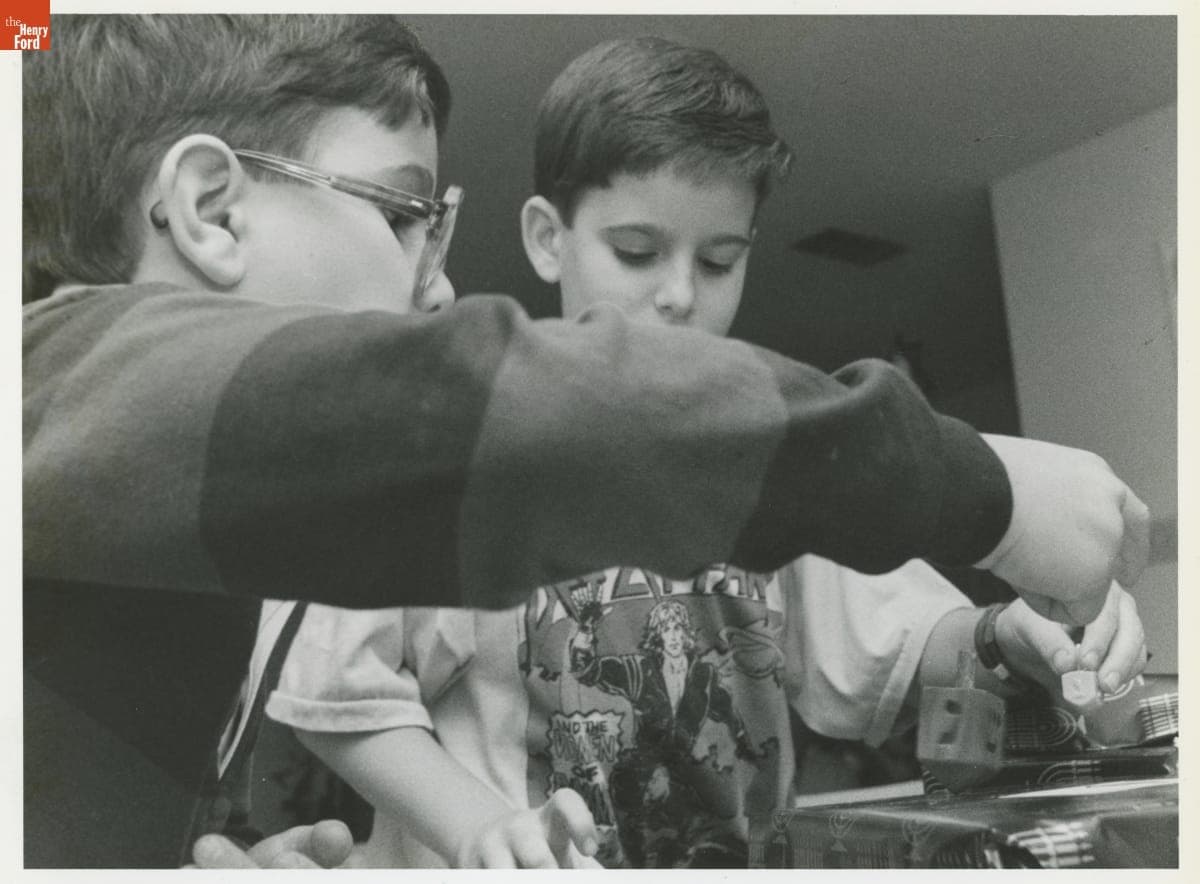 Adam and Joshua Bernstein Play with Dreidels during a Hanukkah Celebration, Mandeville, Louisiana, December 5, 1988