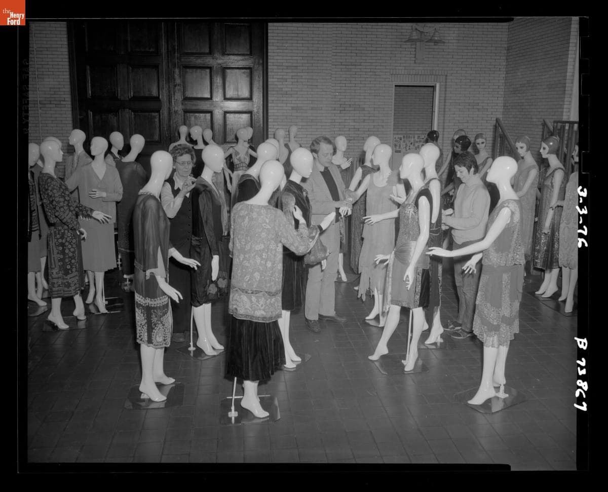 Employees Installing Sports Cars in Review Exhibit, 1976