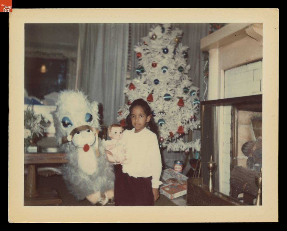 Jawana Jackson with Christmas Gifts inside the Jackson Home