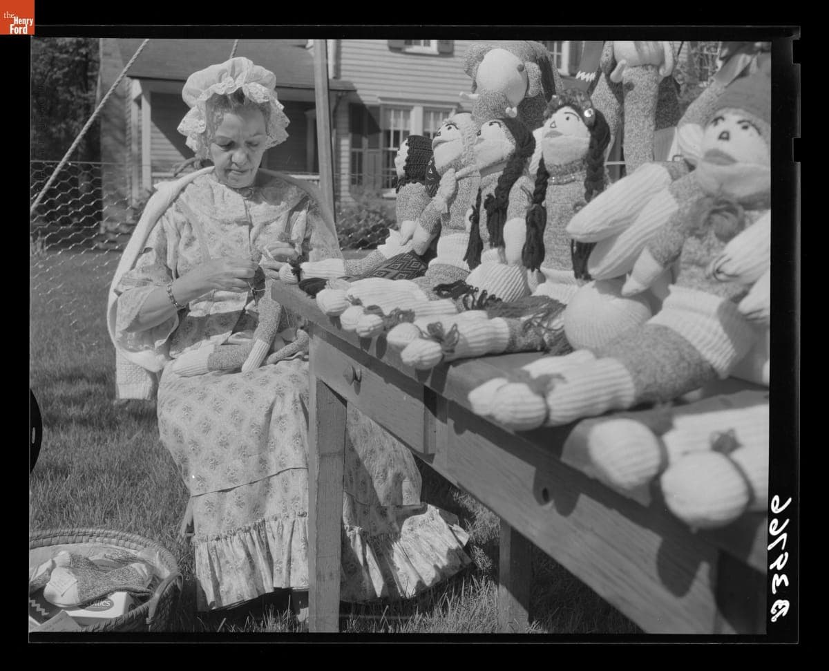 Yvonne Prieur Sewing Stocking Dolls at the Greenfield Village Country Fair, May 1965