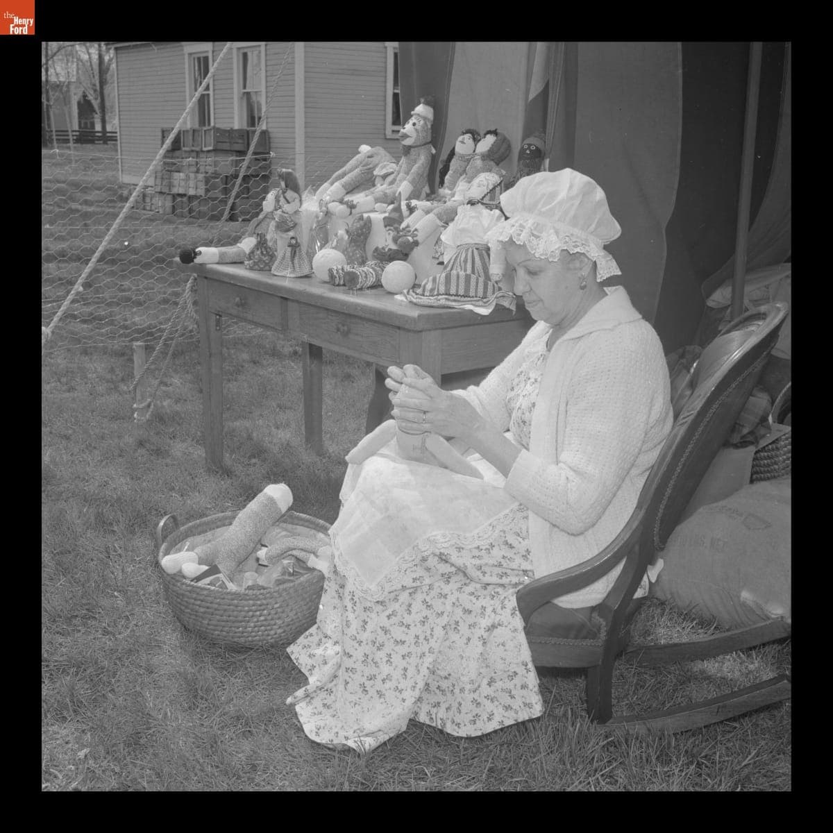 Yvonne Prieur in Costume Making Dolls at the Greenfield Village Country Fair, May 1967