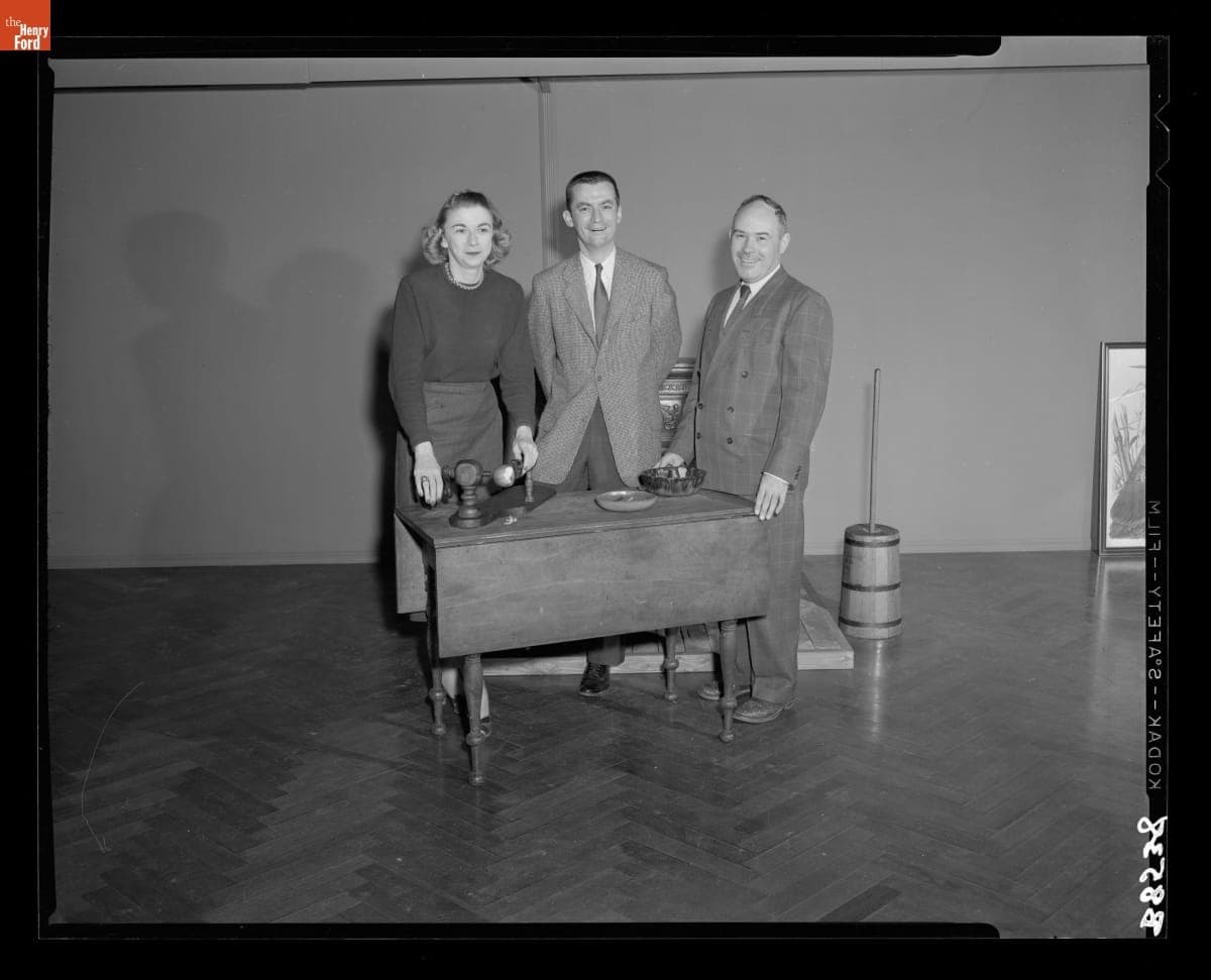 Curators Katharine Bryant, Gerald Gibson and George Bird prepare for "Christmas Feast" in Henry Ford Museum, December 1954