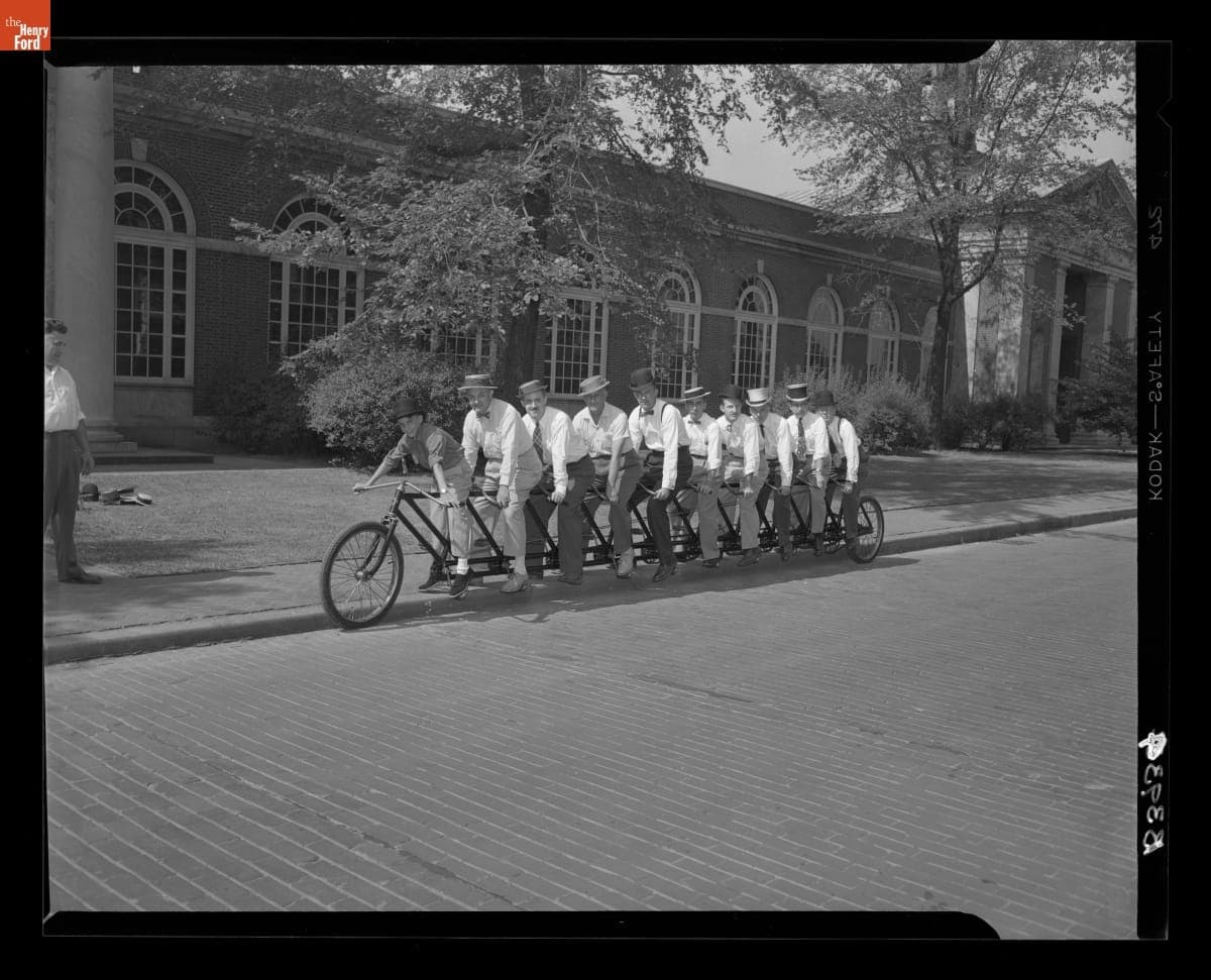 Henry Ford Museum Staff Members and Others Seated on the Ten Seat "Oriten" Bicycle, 1953