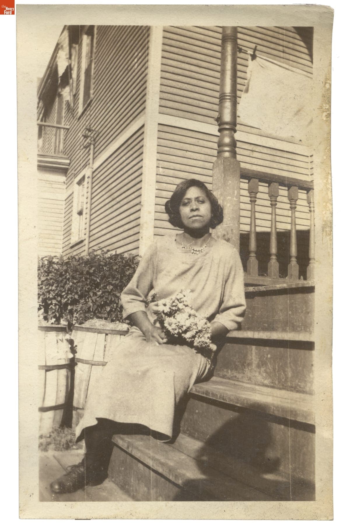 Woman Holding a Bouquet of Flowers, circa 1930