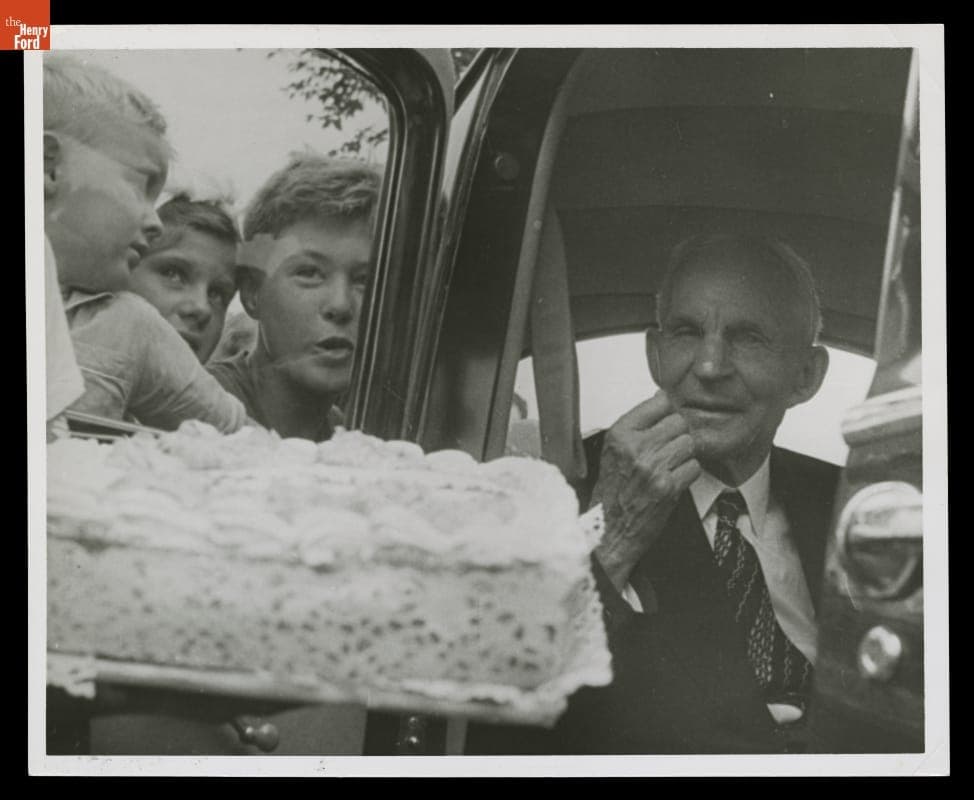 Henry Ford Being Offered a Cake on His 83rd Birthday, Levagood Park, Dearborn, Michigan, July 30, 1946