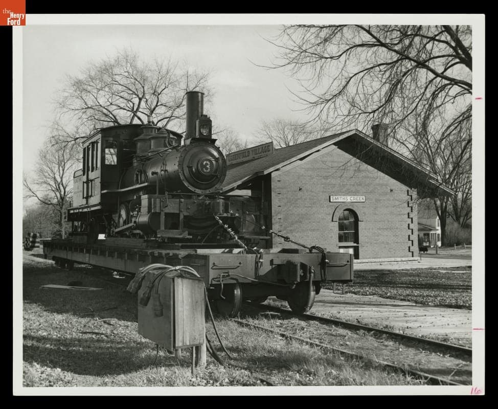 Torch Lake Steam Locomotive Arriving on a Flatcar at Smiths Creek Depot, Greenfield Village, 1969