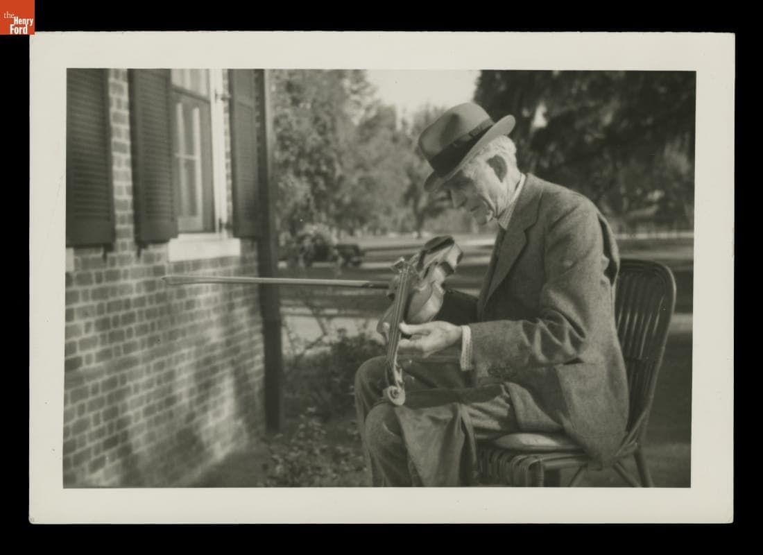 Henry Ford Examining a Violin, circa 1939