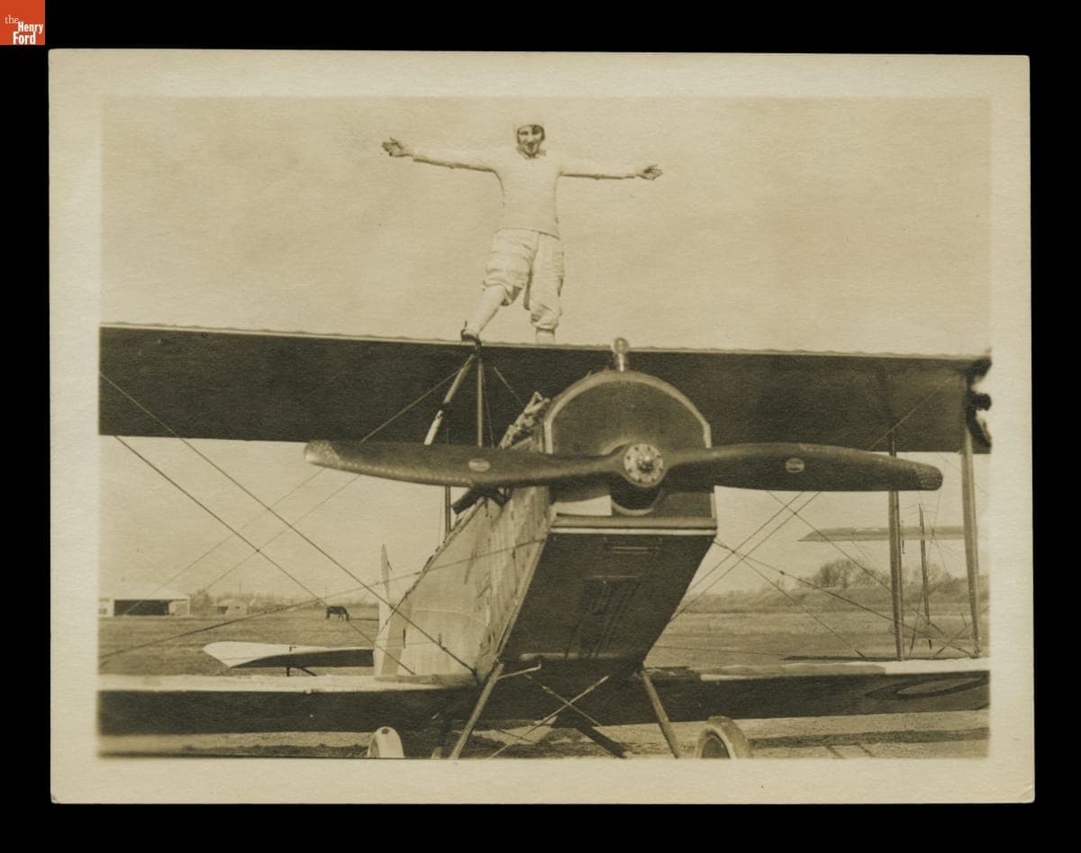 Aerial Stunt Performer Lillian Boyer Standing Atop an Airplane, circa 1922