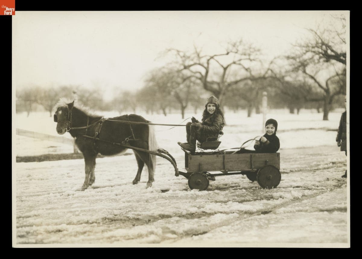 Josephine and William Clay Ford Riding a Pony-Drawn Cart, December 31, 1929