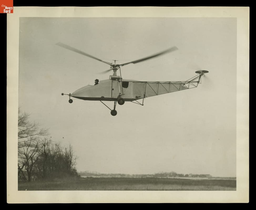 Igor Sikorsky Piloting Vought-Sikorsky Helicopter, Hovering over a Field, circa 1942