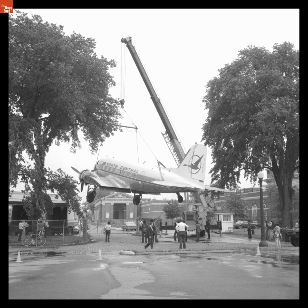 Installing the 1939 Douglas DC-3 Airplane behind Henry Ford Museum, 1975