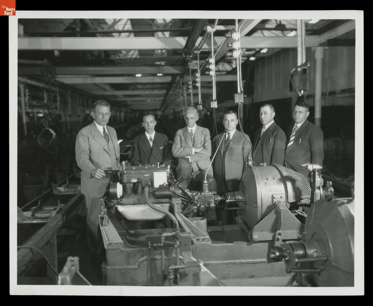 Henry Ford, Edsel Ford, and Ford Motor Company Executives with Model A Engine, October 1927