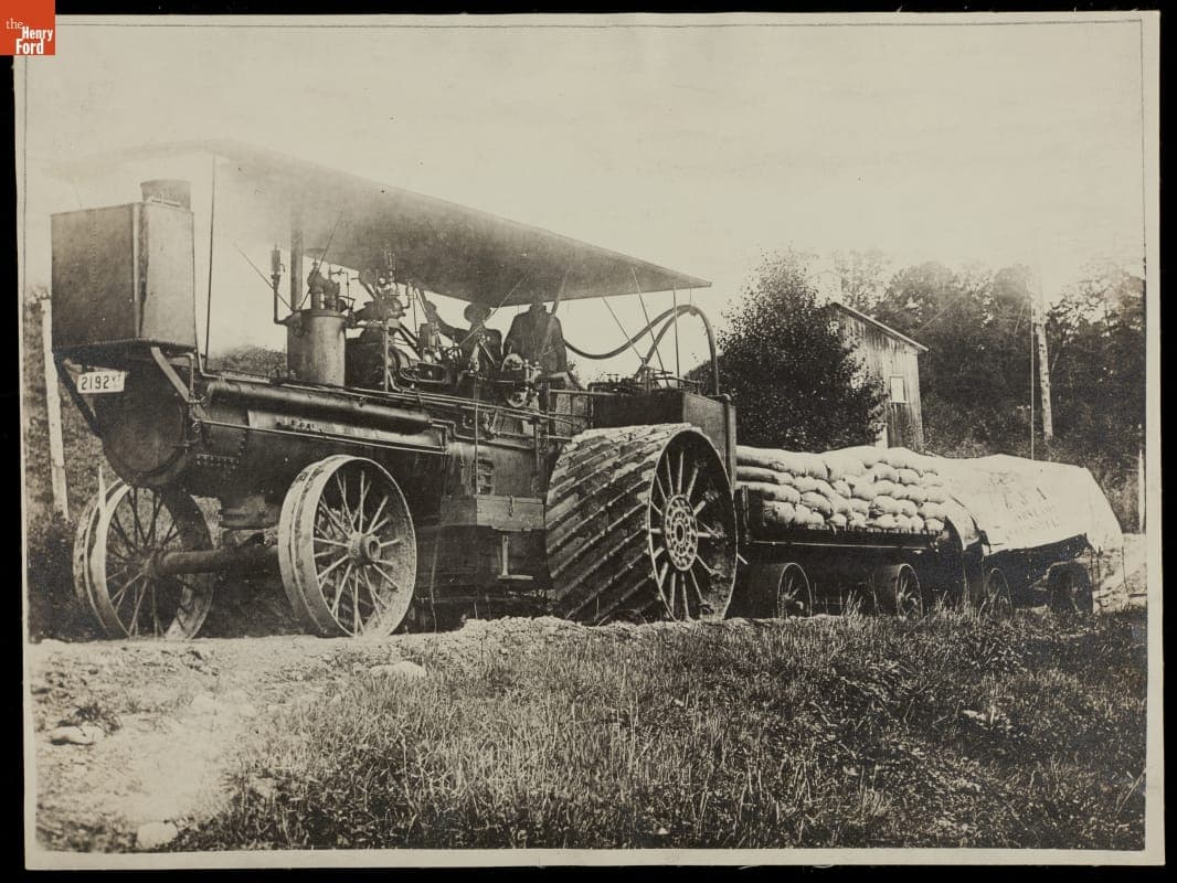 Engineer and Fireman aboard Traction Engine, Pulling Load of Asbestos, circa 1910