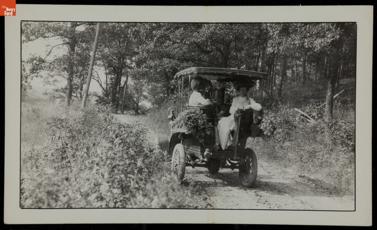 Two Women Looking Out the Back of 1904 Packard, circa 1905