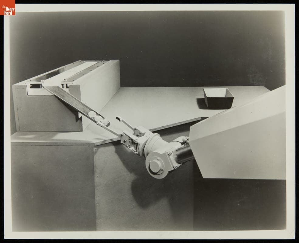 Unimate Industrial Robot Taking a Rough Billet from a Conveyer to Place in a Die, circa 1961
