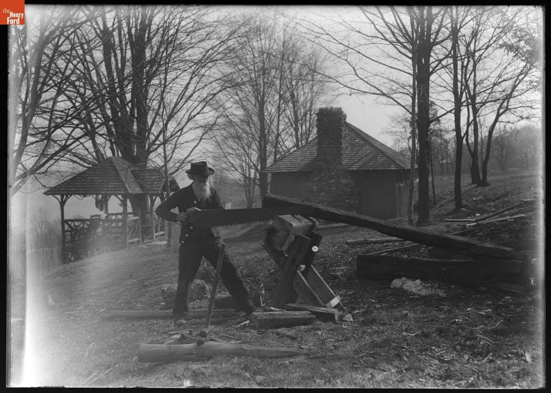 John Burroughs Sawing Wood near His Study at Riverby, 1910-1920