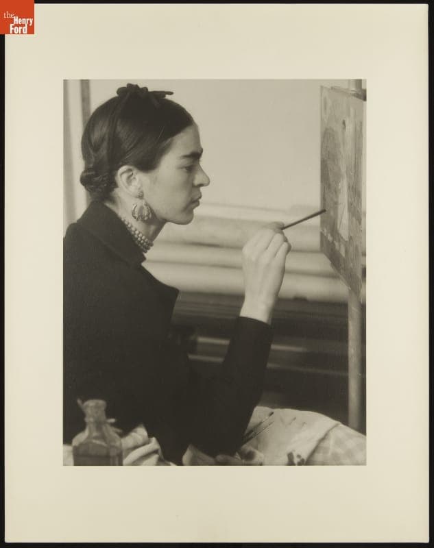 Frida Kahlo at Work on "Self-Portrait on the Border Line between Mexico and the United States," 1932