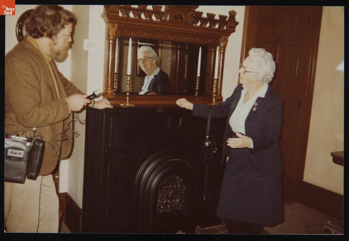 Curator of Agriculture Peter H. Cousins and Marion Harrel in the Parlor of Firestone Farm at its Original Site, Columbiana County, Ohio, 1983
