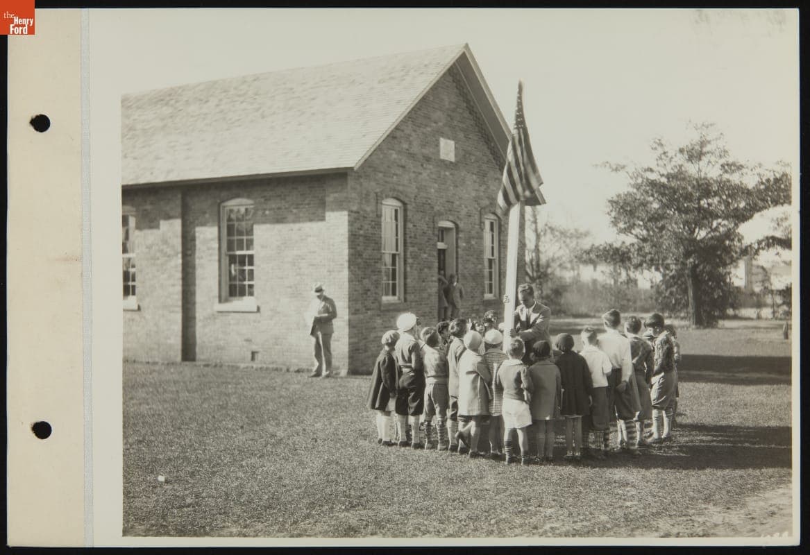 Man with Group of Children outside Scotch Settlement School, Greenfield Village, October 1929