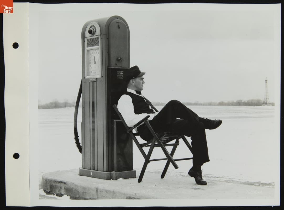 Gas Station Attendant Seated at Fuel Pump, 1940