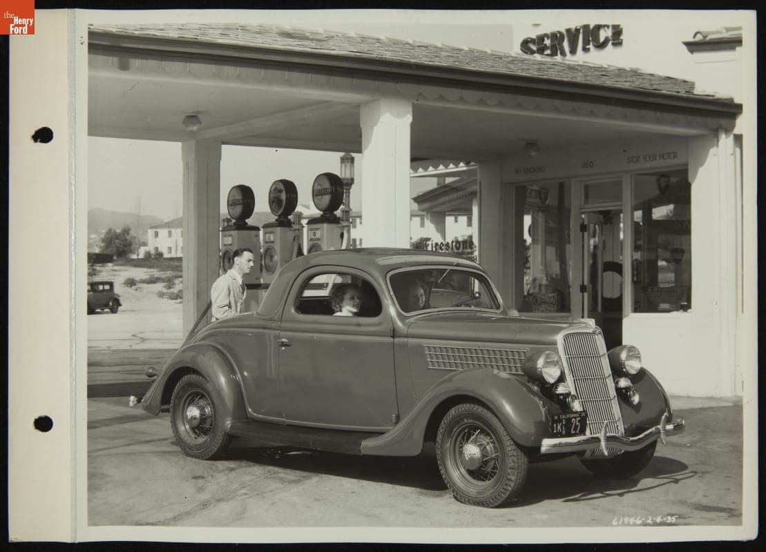 Ford V-8 DeLuxe Coupe (3W) at a Service Station, February 1935