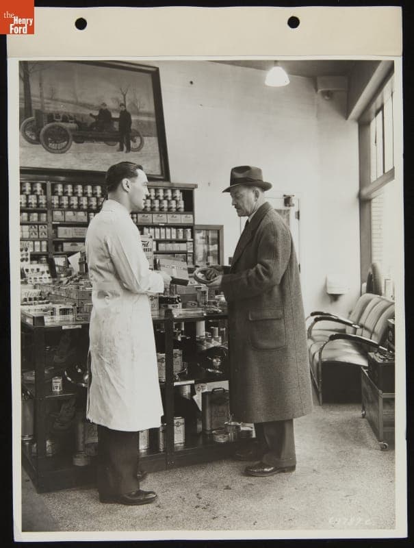 Service Attendant Shows Customer Ford Accessories, January 1938