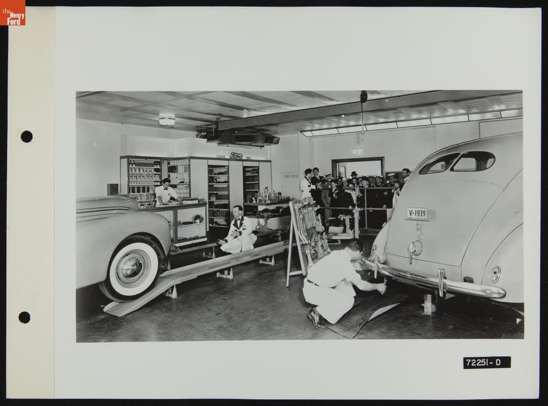 Crowd Watches Attendants Work in Service Garage, Illustration in the August 1939 Ford Merchandising Bulletin