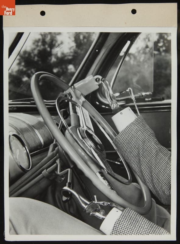 Driver Demonstrates Steering Wheel Attachments on Mercury Car for Handicapped Drivers, August 1945