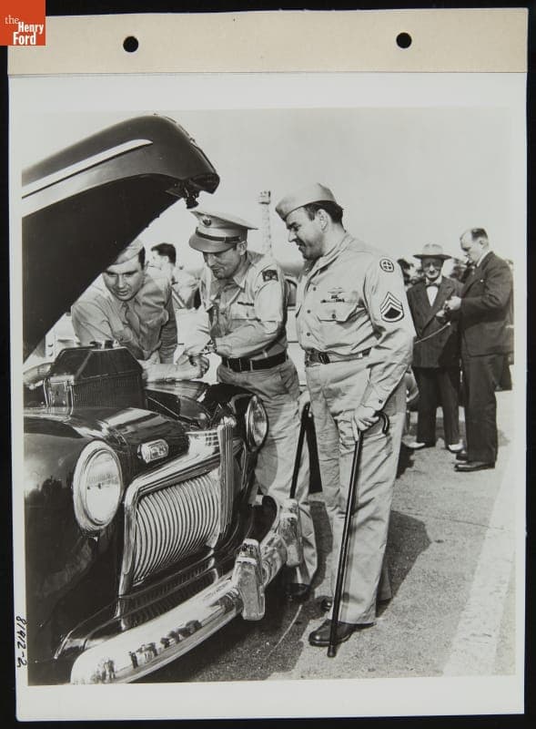 Disabled Veterans Inspecting Automobile Engine, July 1945