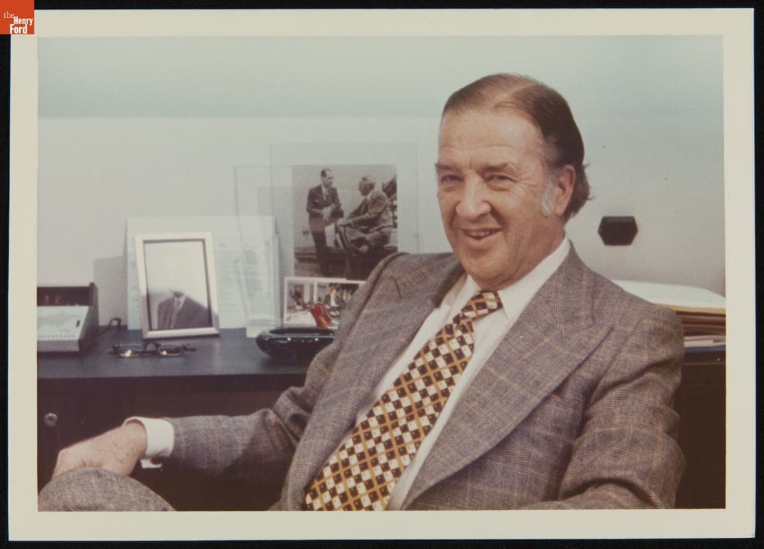 Henry Ford II at Desk with Photo of Henry Ford and Edsel Ford in Background, circa 1977