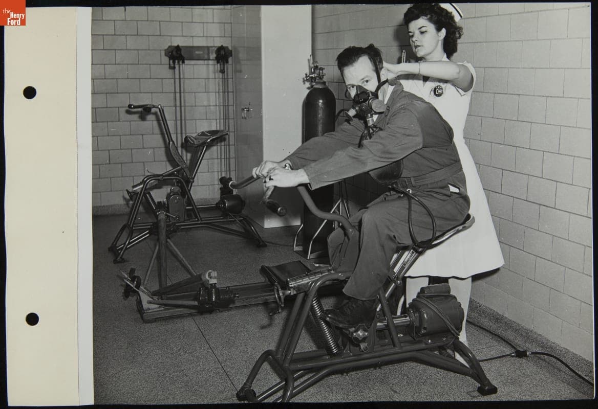 Nurse Assisting Man with Denitrogenation for Altitude Flying, Willow Run Bomber Plant, October 1943