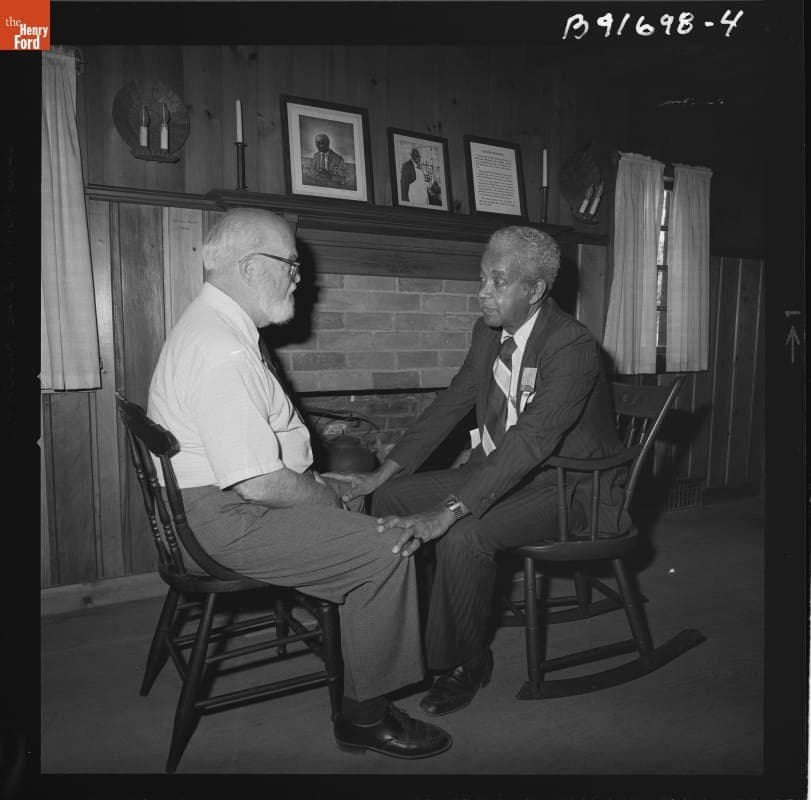 Ross Callaway and Austin W. Curtis inside the George Washington Carver Cabin in Greenfield Village, August 17, 1982