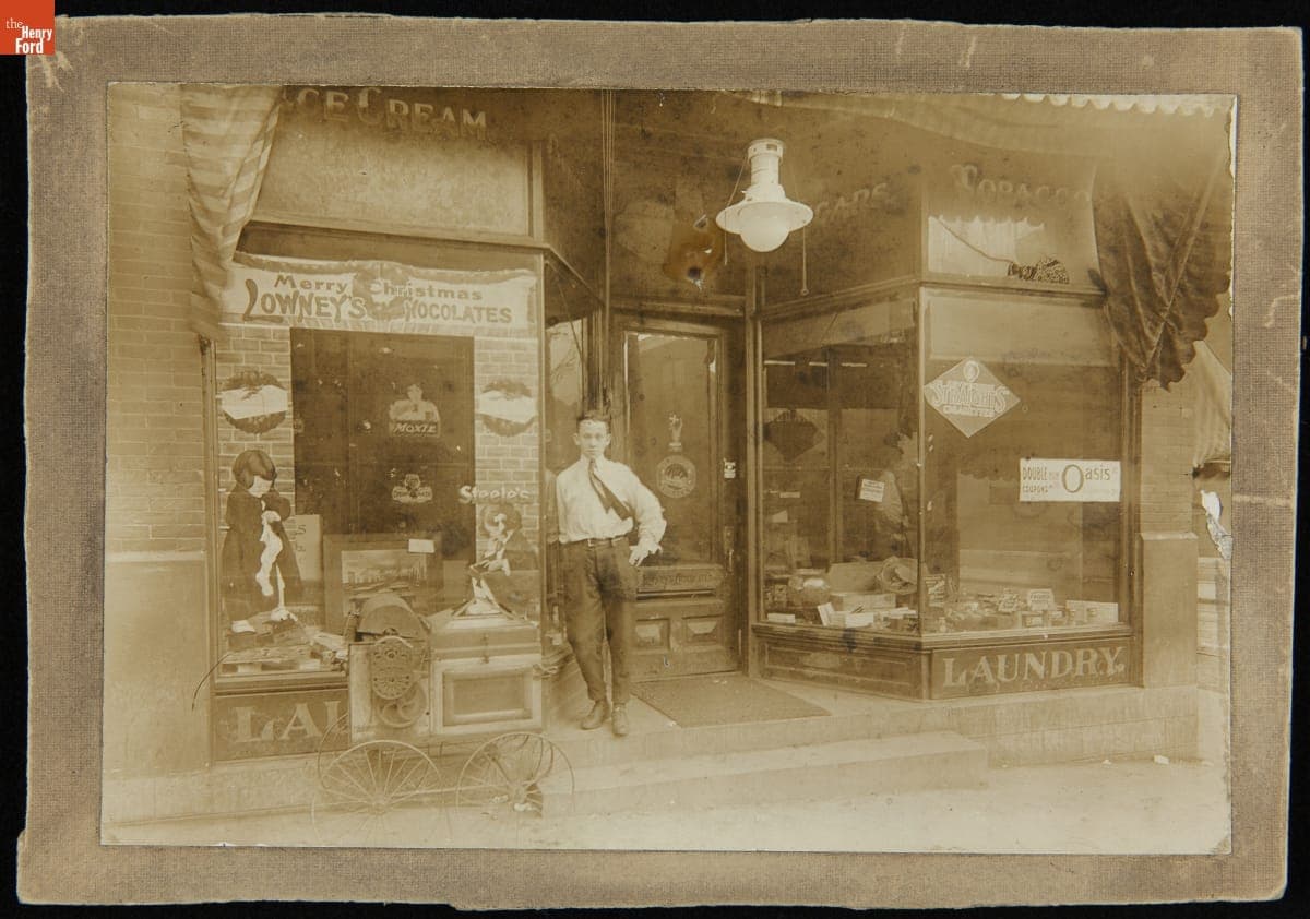Young Man Posing in Front of a General Store, Turtle Creek, Pennsylvania, circa 1910