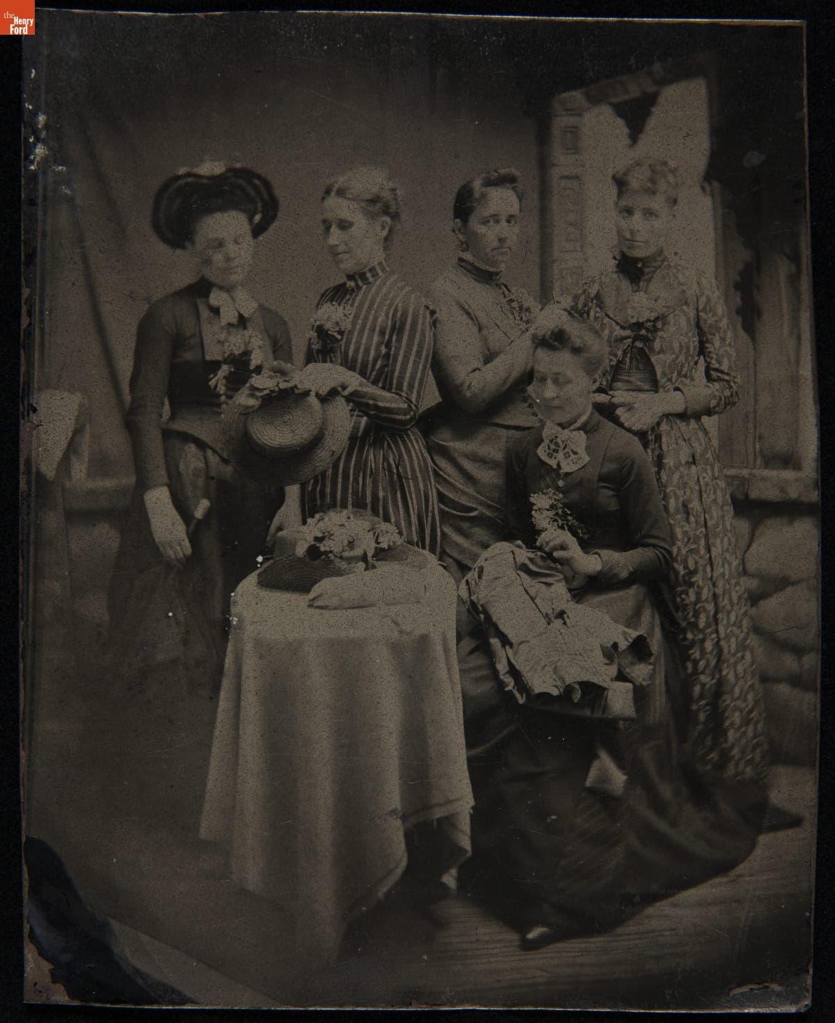 Mrs. Plumb and Friends Working on Clothing and Hats, circa 1885