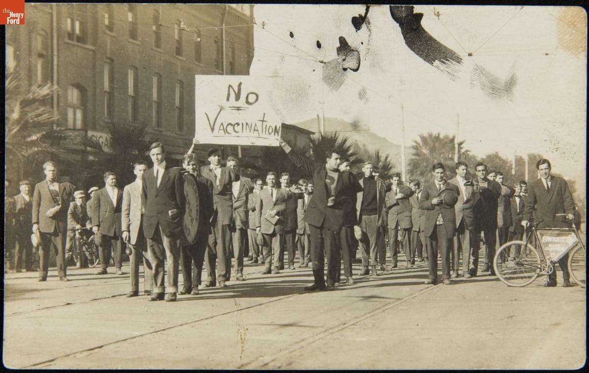 Men Marching While Holding Up a "No Vaccination" Sign, 1907-1917