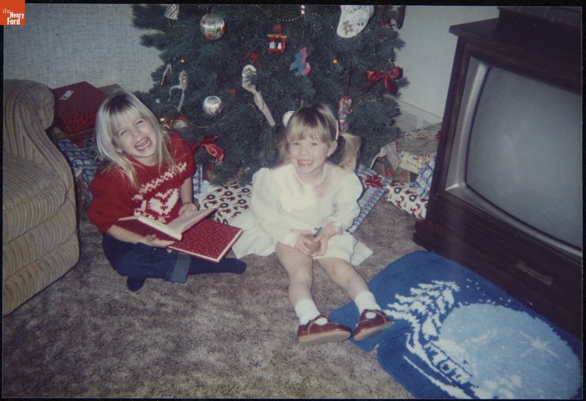 Lauren and Stephanie Jackson by the Christmas Tree with Their Books, 1985