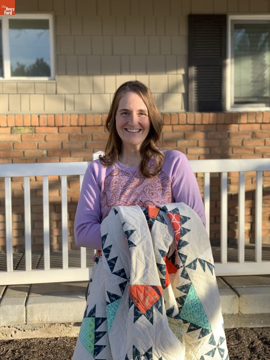 Kristin Barrus Holding her Quilt "A Cotton + Steel Gift," Machine Quilted by Melissa Kelley in 2017
