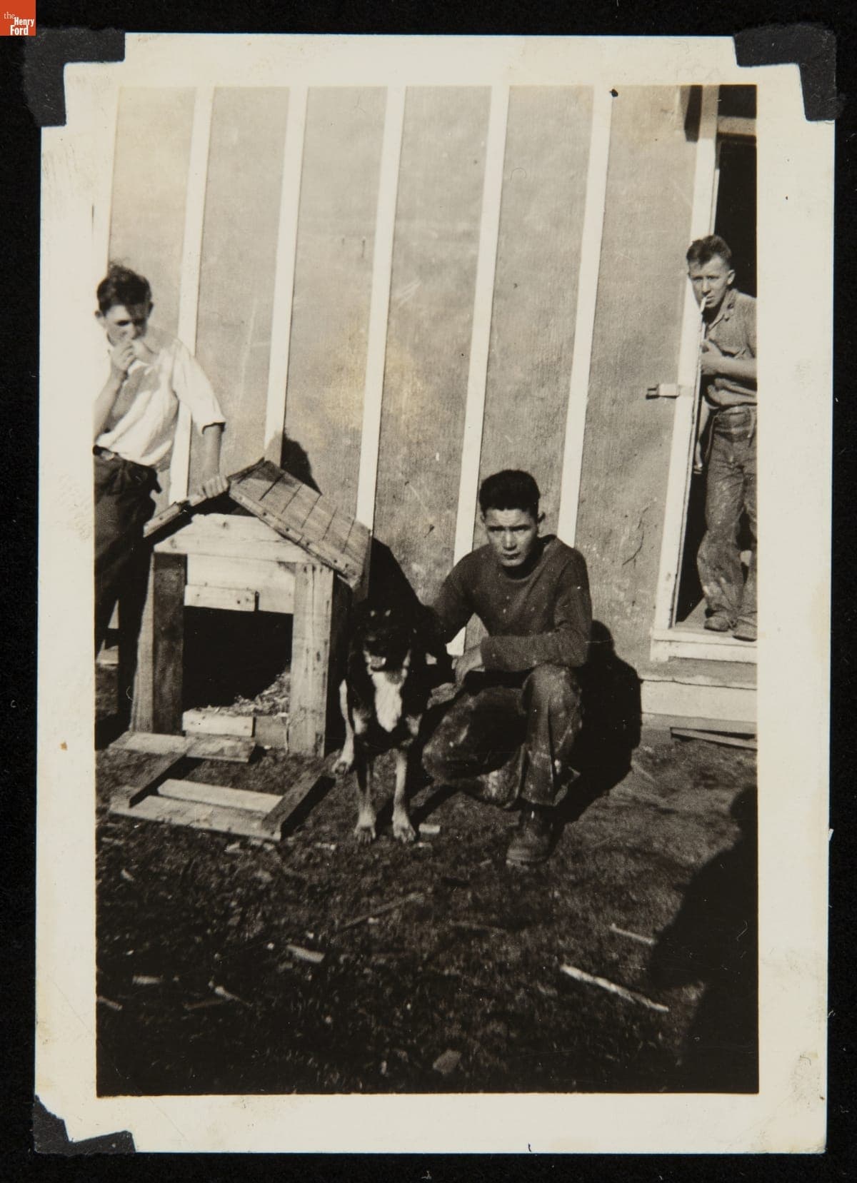 Stanley Zaleski and a Dog outside Civilian Conservation Corps Barracks, 1934