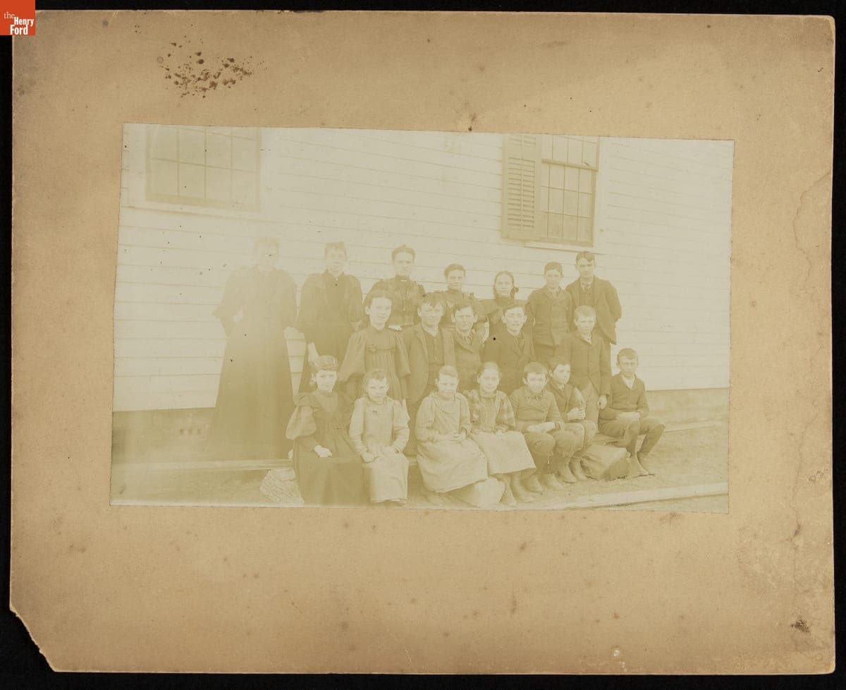 Students and Teachers Standing on the Porch of a Frame Building, circa 1893