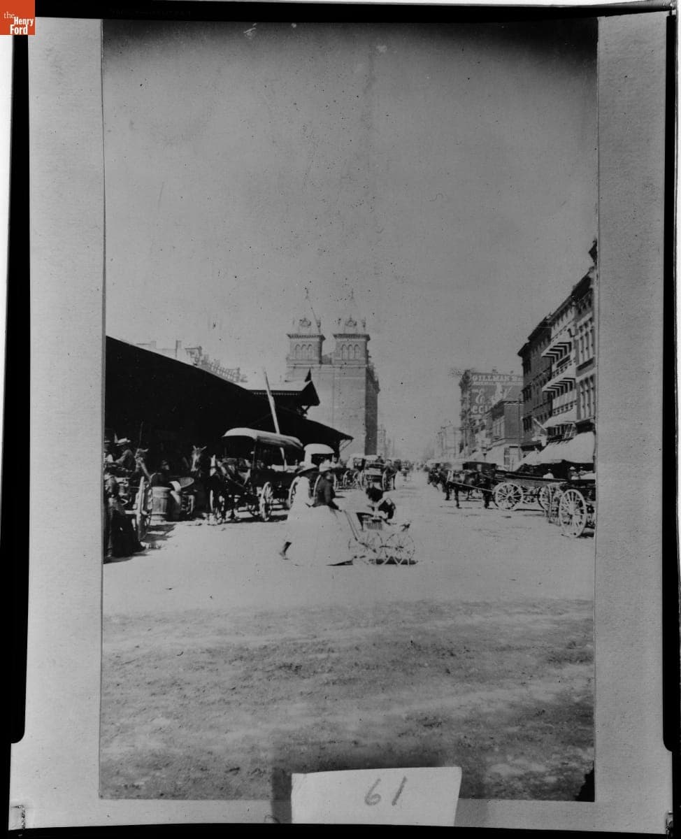 Woman Pushing a Baby Carriage at Central Market, Detroit, Michigan