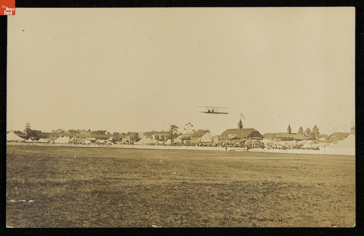 Biplane Flying over the Fairgrounds at Rochester, New Hampshire, circa 1910