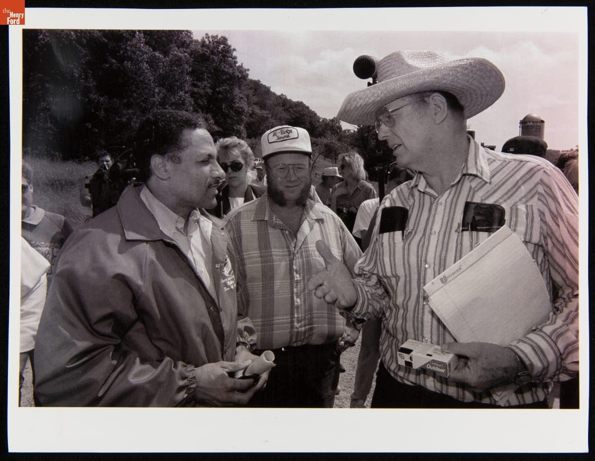 United States Secretary of Agriculture Mike Espy Talking with Wisconsin Farmer Marcus Gumz, July 1, 1993