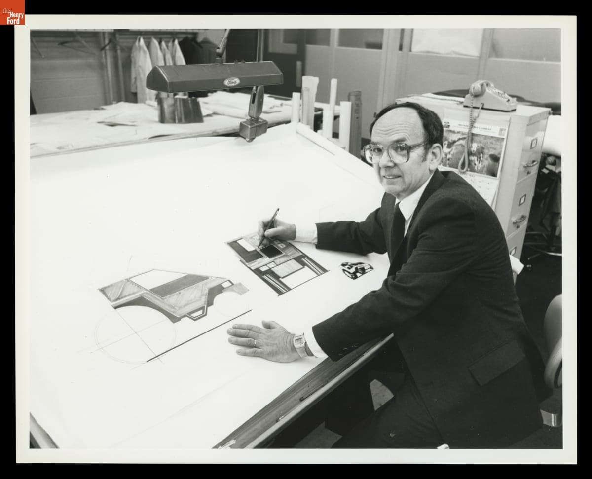 Man Sitting at a Design Board with Ford Tractor Drawings, 1984