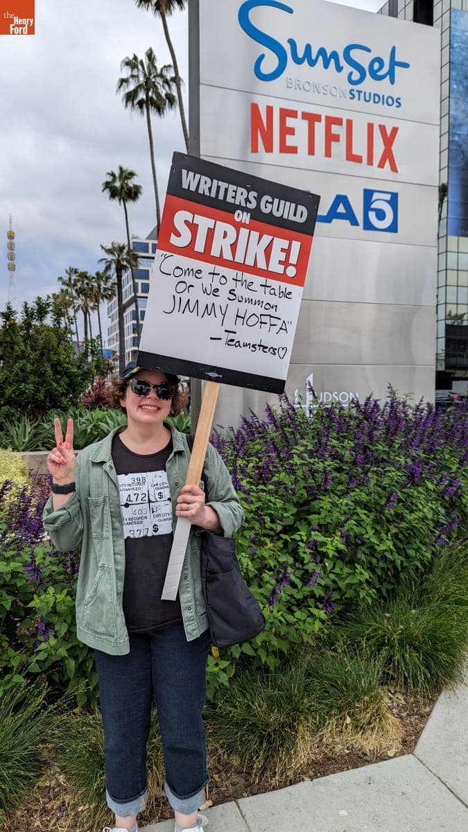 Kristen Gallerneaux Holding a Sign that Reads "Come to the Table, or We Summon Jimmy Hoffa -Teamsters," June 3, 2023