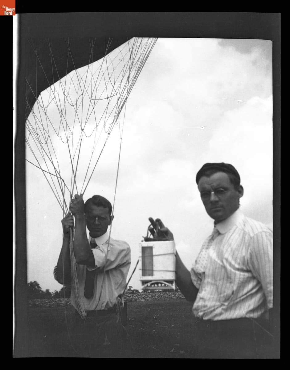 Two Men Holding a Weather Balloon and Equipment, 1915-1930