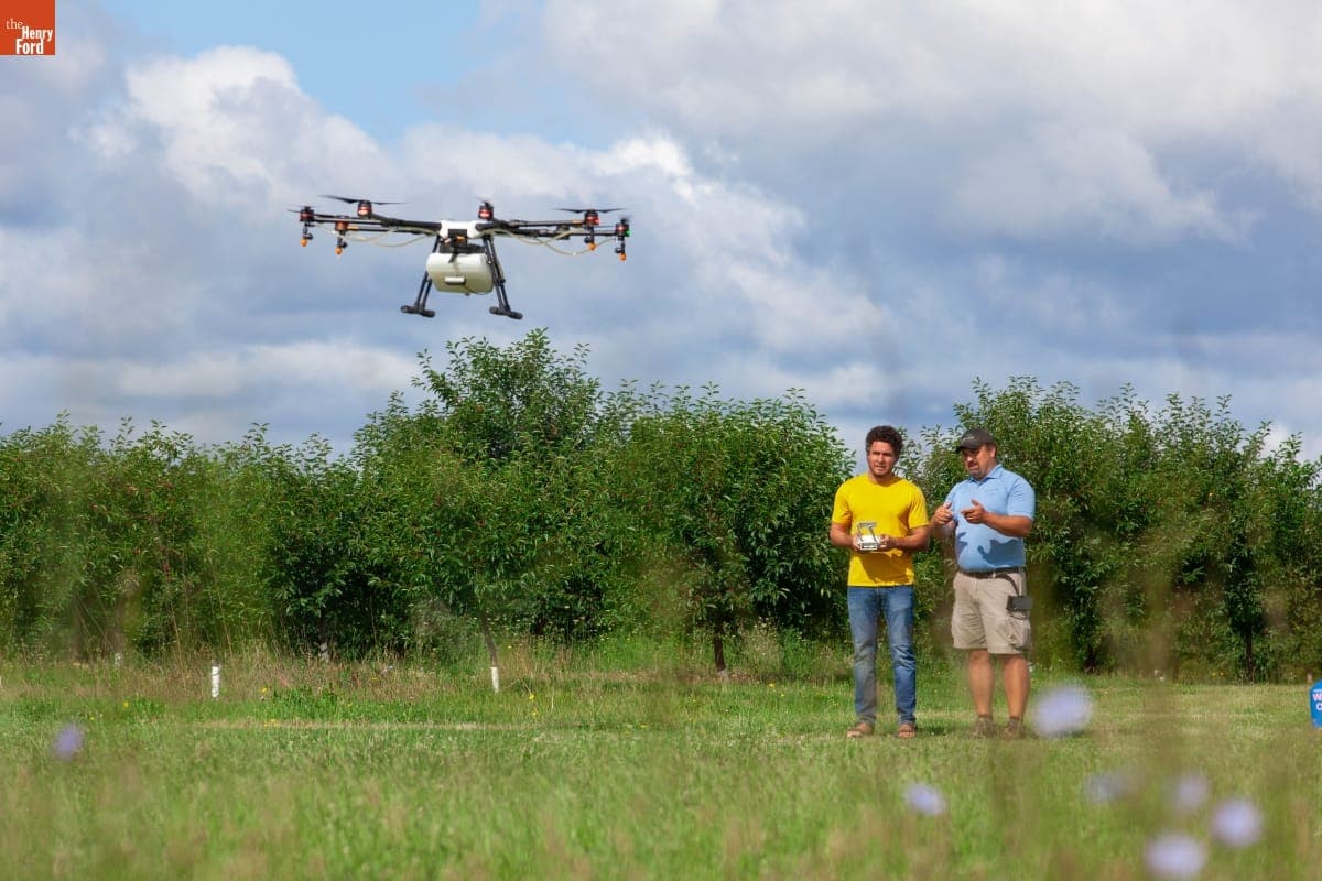 Two Men Working with "Agras MG-1" Drone