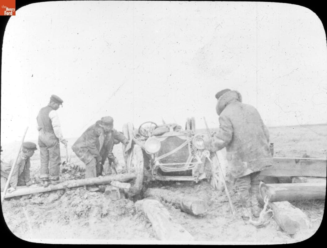 Team Using Logs to Raise Thomas Flyer Out of the Mud in Nevada, New York to Paris Race, 1908
