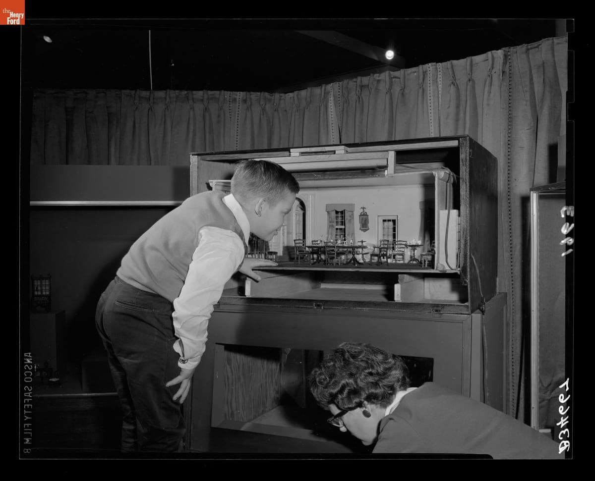Kent Ehrle and Sarah Leudders Looking at "The World in Miniature" Christmas Exhibit, December 1963