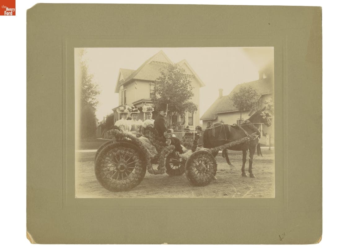 Passengers in a Horse-Drawn Carriage Decorated for a Parade in Jackson, Michigan, circa 1895