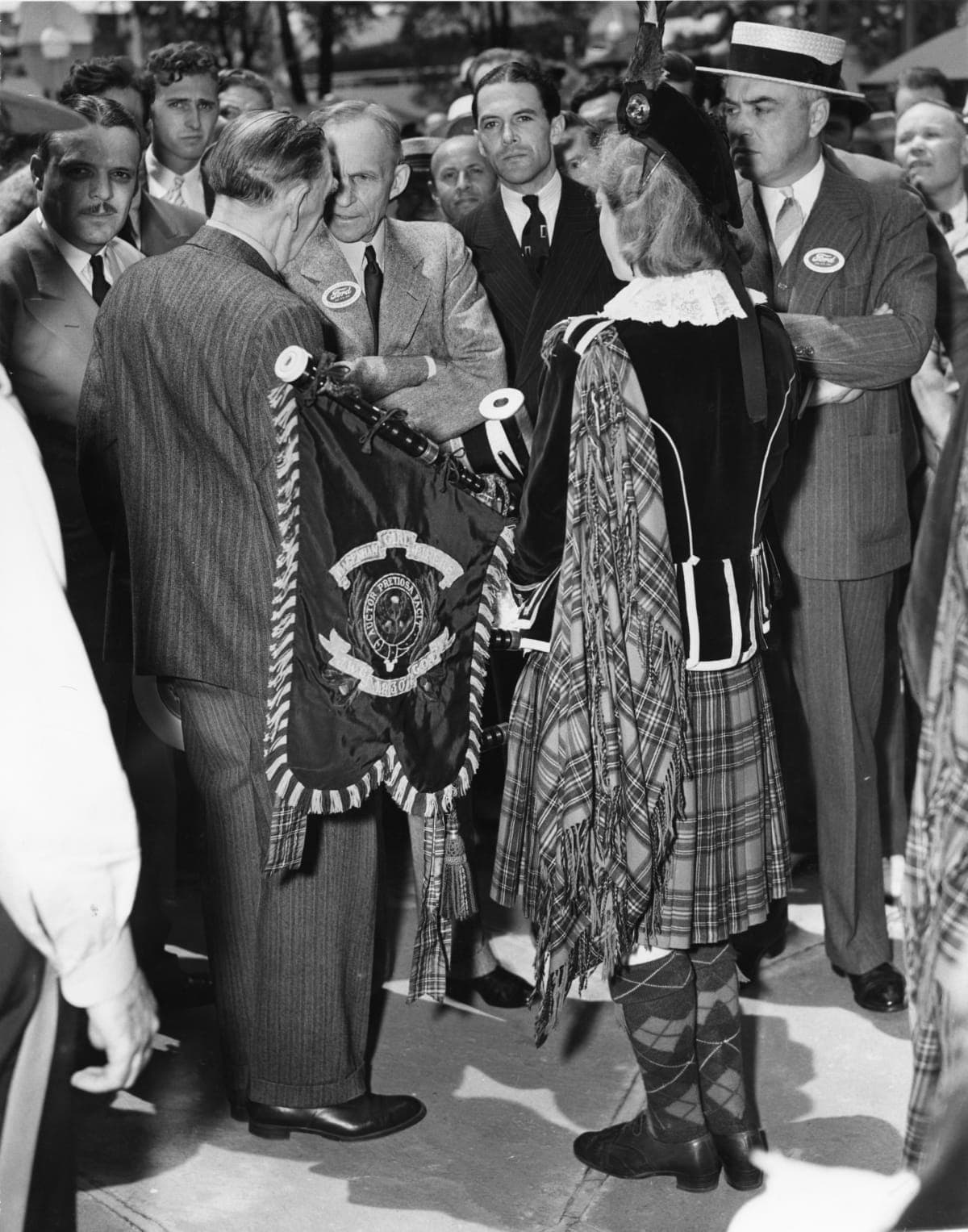 Henry Ford with Pipe Major Edith Turnbull, Dagenham Girl Pipers at the New York World's Fair, 1939